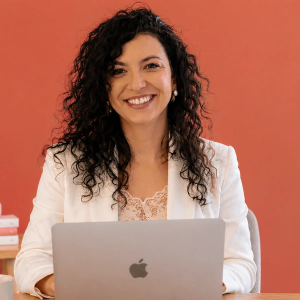 Nadia Mohamed, technical SEO and GEO consultant, working at her laptop
